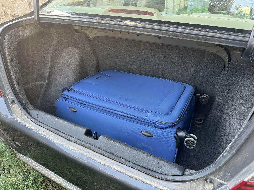 Boot space with blue luggage