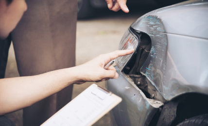 Insurance Agent Working On Car