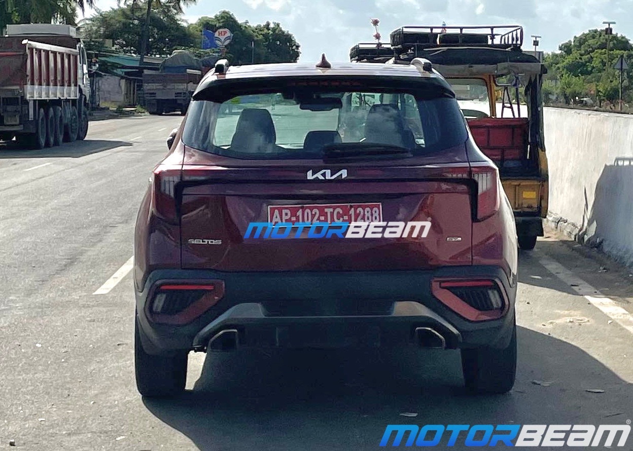 Red compact SUV rear profile